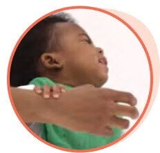 Shaking their head "no"